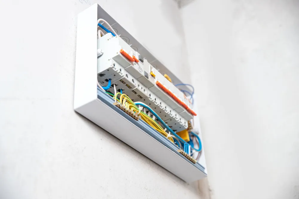Hills District residential electrician installing wiring inside a family home